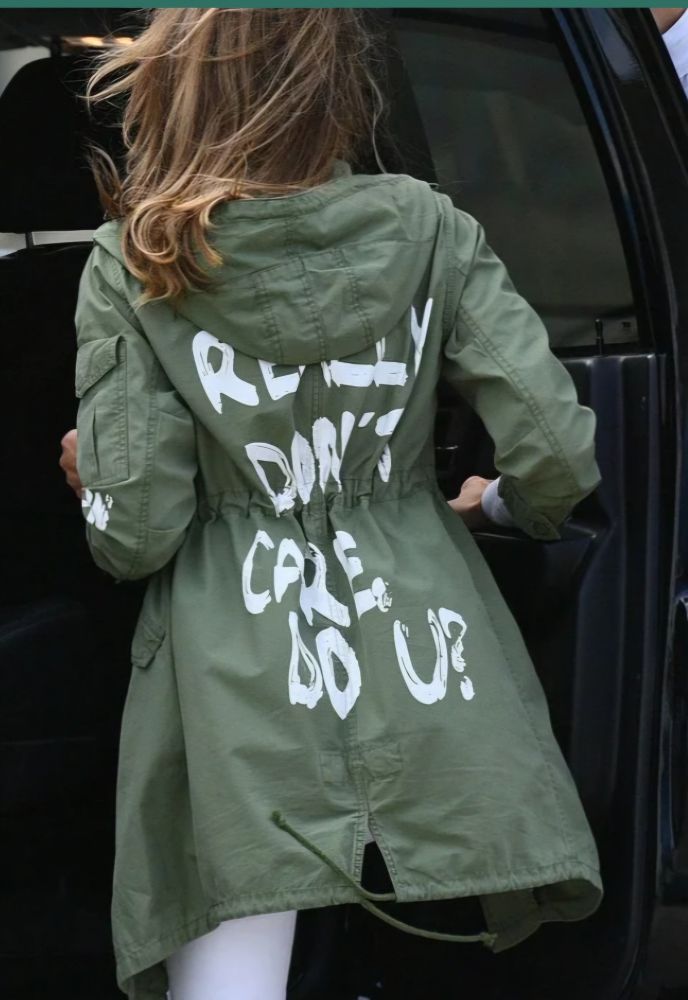 Melania Trump, as FLOTUS, is wearing a jacket that says I REALLY DON'T CARE DO YOU? while entering a vehicle on her way to visit immigrant children separated from their families at the US border.