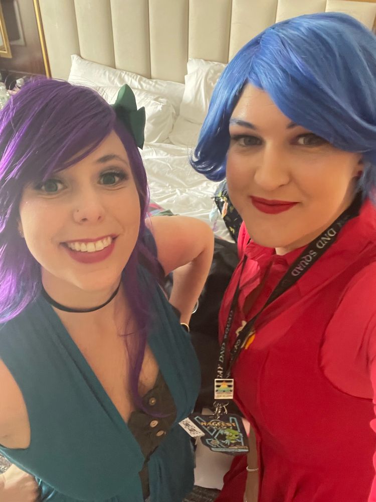 Two cosplayers dressed as Abigail and Emily from Stardew Valley