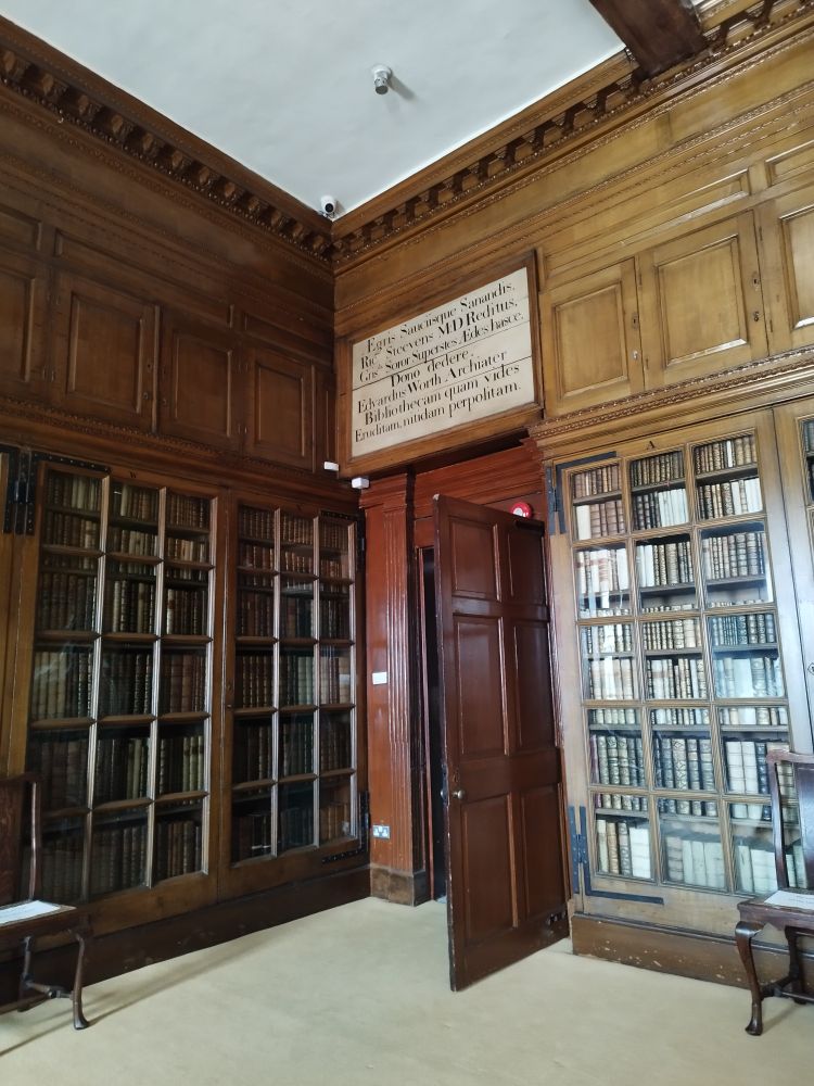Wooden bookcases filled with rare books