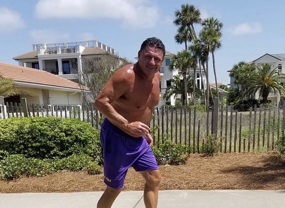 coach o shirtless and jogging in lsu shorts 