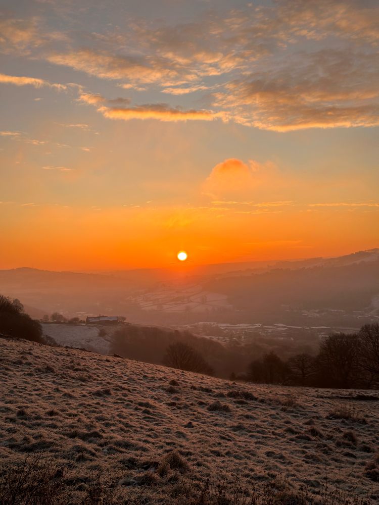 A golden winter sunset over a valley in West Yorkshire 