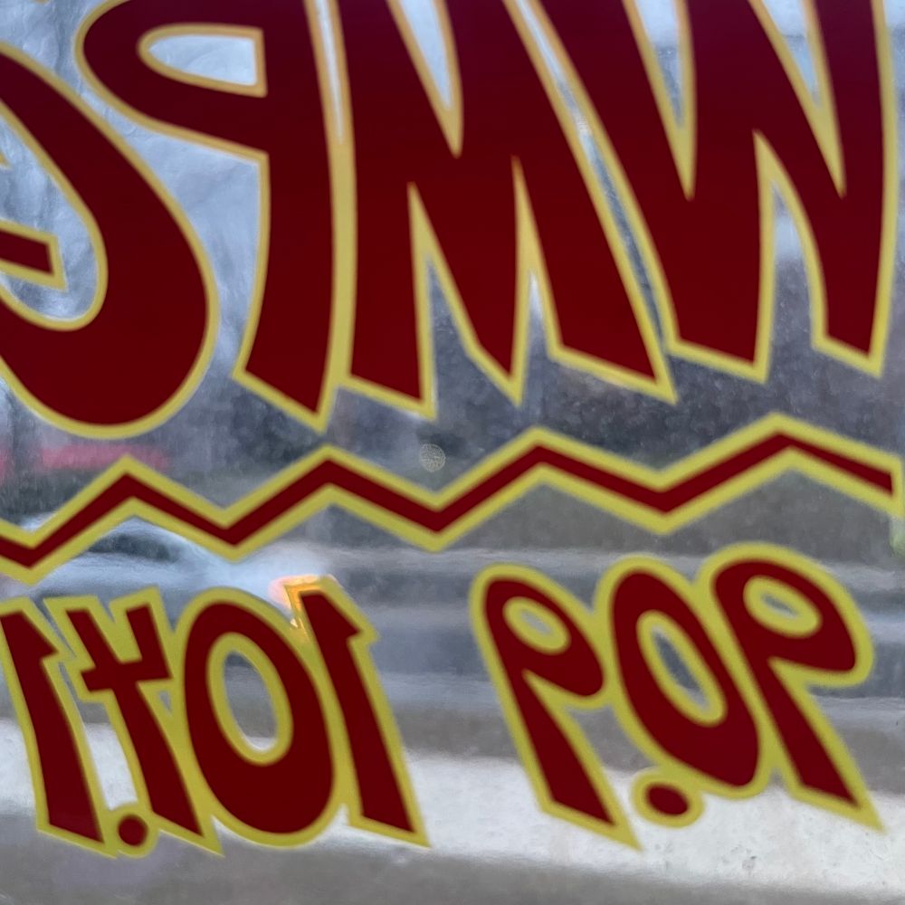 WMPG sticker in station window 