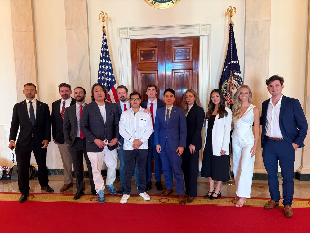 right-wing influencers standing for a photo together at the white house
