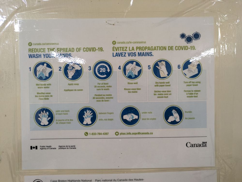 A poster in a Park Canada washroom that asks people to wash their hands telling them it will stop the spread of COVID, while we know now that it spreads through the air...