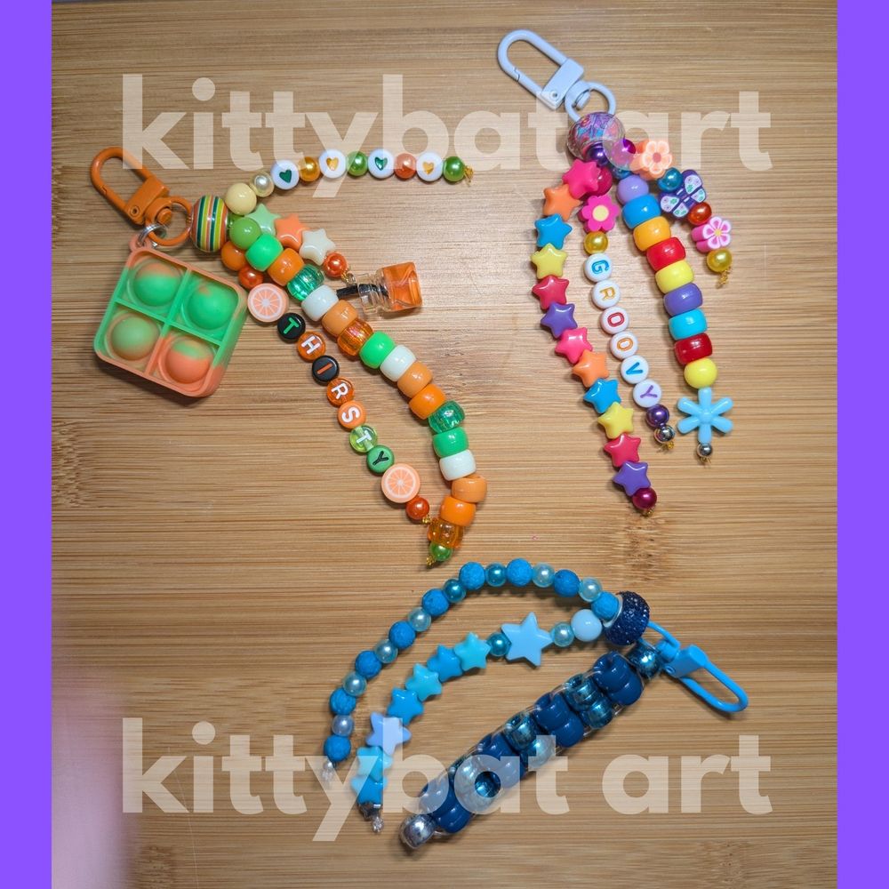 three keychains made with pony beads that say 