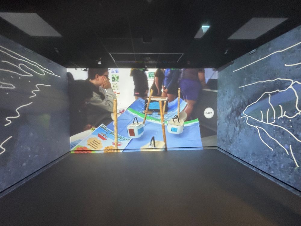 A view into the immersive suite showing imagery from the project.