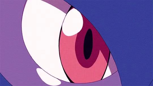 a close up of a cartoon character 's eye with a pink pupil .