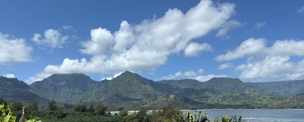 Mountains and waterfalls overlooking Hanalei Bay.