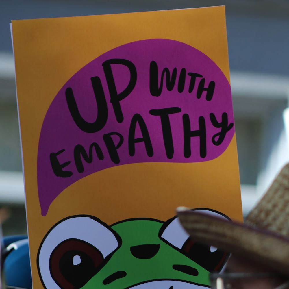 up with empathy sign