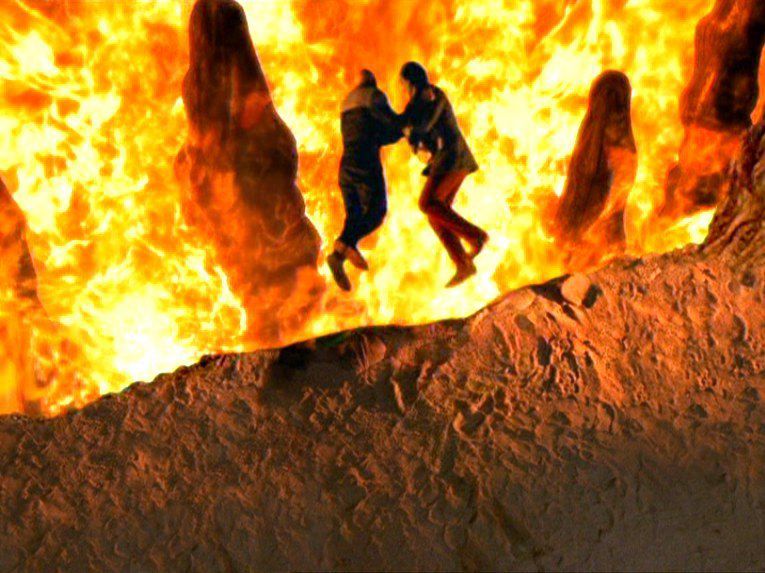 A photo from the finale of Star Trek Deep Space Nine of Captain Sisko pulling Gul Dulat into the pit in the fire caves. 