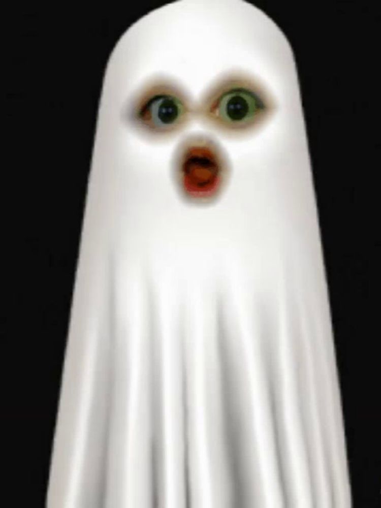 a white ghost with green eyes and a surprised look on its face