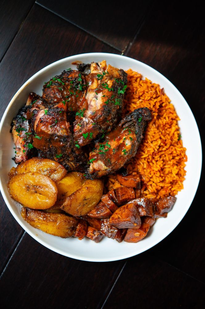 smoked jerk chicken, jollof rice, candied yams and plantains.