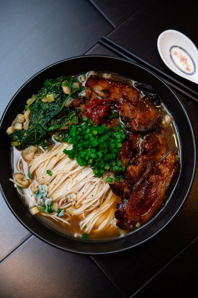 braised pork, sautéed green vegetables and noodle soup.