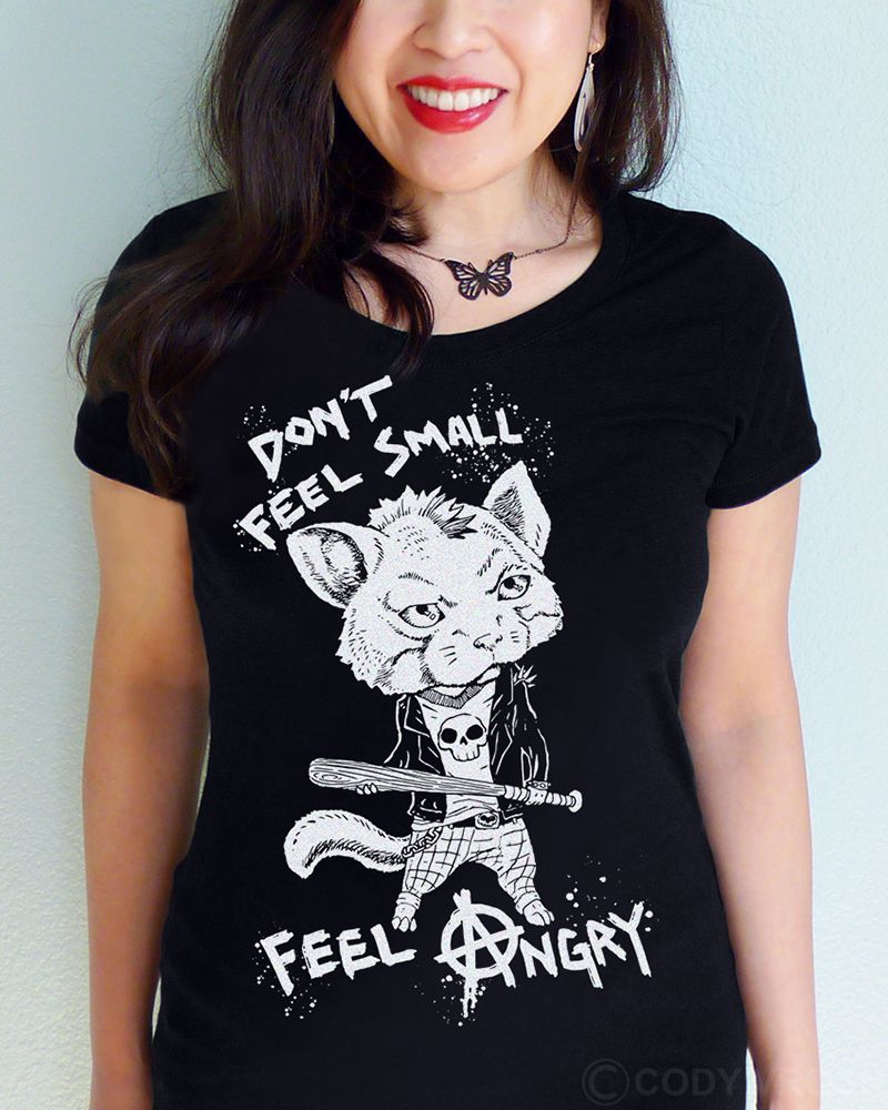 Photo of a person wearing a shirt with a punk rock cat.