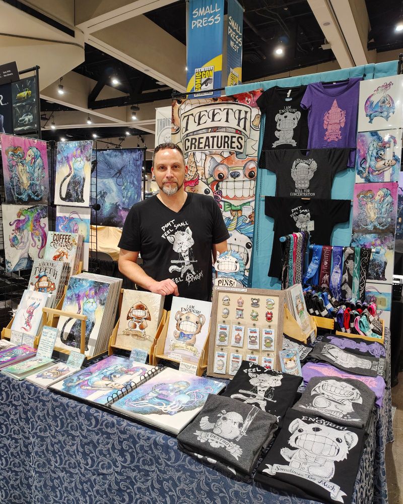 Photo of my booth setup at SDCC 2025