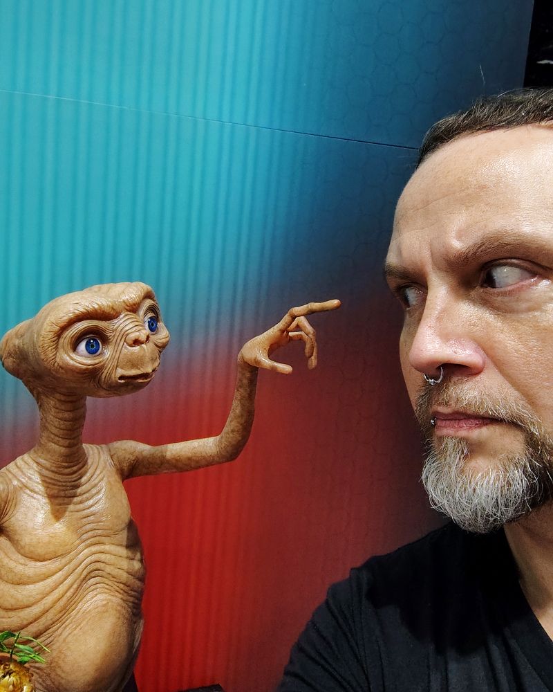 Photo of me and an E.T. statue.