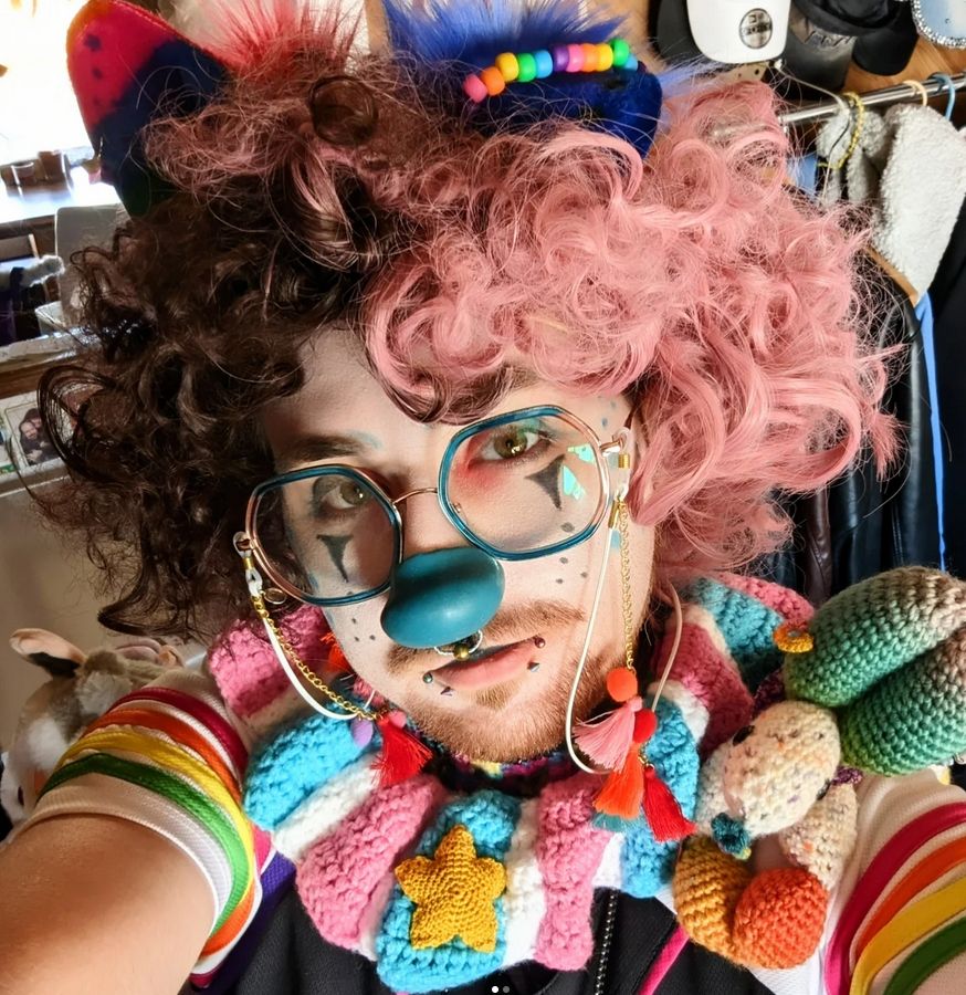 Clown pup from the artwork and the crocheted balloon dog, Fruity Pebbles.