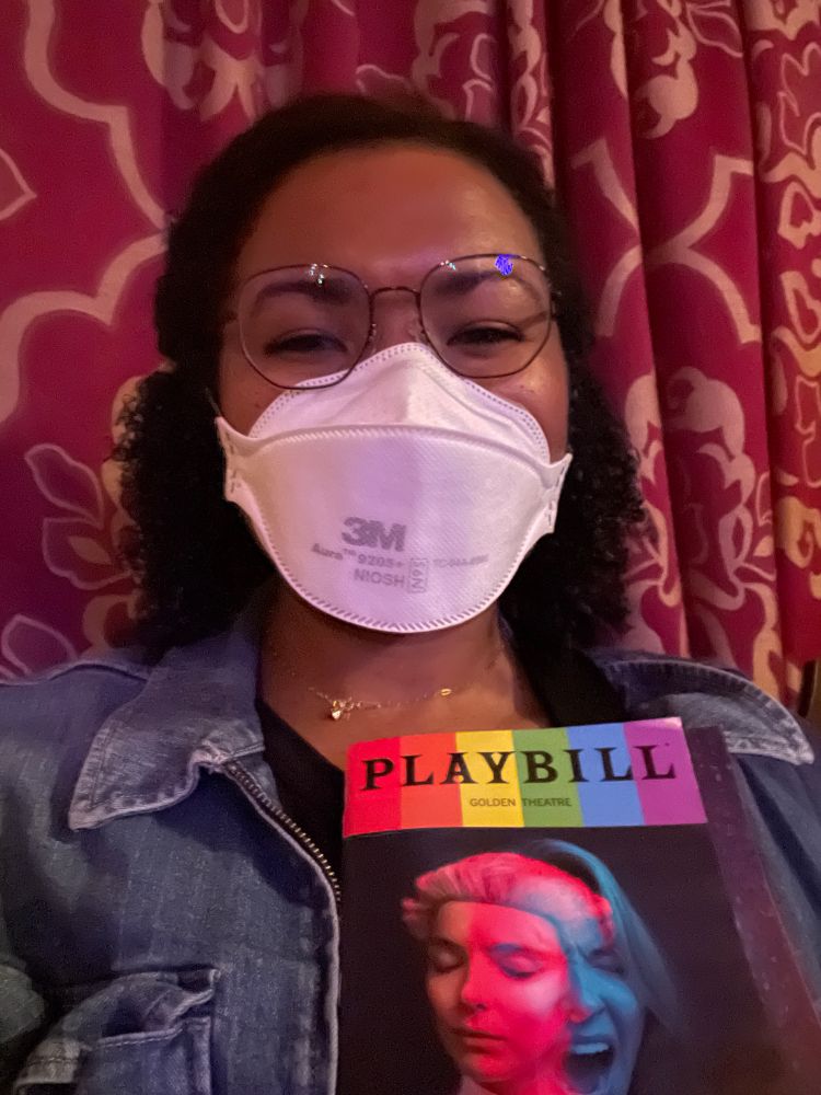 Angela takes a selfie while wearing a 3m aura mask and glasses.