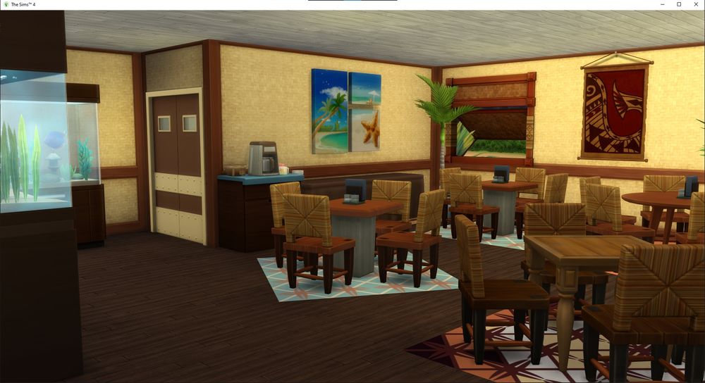 Four  dining tables and games tables.  Counter with coffee pot on it, next to a banquet table.  You can see the swing doors to the kitchen. two fish tanks.