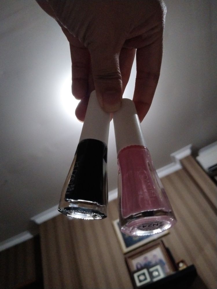 Pink and black nail polishes
