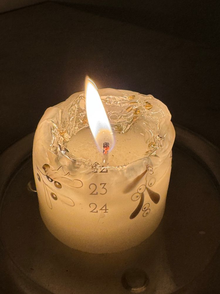 Candle burning-it is a candle that counts down to Christmas, and has the numbers 23 and 24 still remaining. 