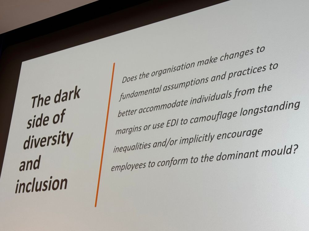 Picture of a slide on ‘the dark side of diversity and inclusion, with the provocation: does the organisation make changes to fundamental assumptions and practices to better accommodate individuals from the margins, or use EDI to camouflage longstanding inequalities and/or implicitly encourage employees to conform to the dominant mould?
