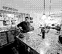 Highly dithered low res B&W photo of an annoyed spouse in a kitchen