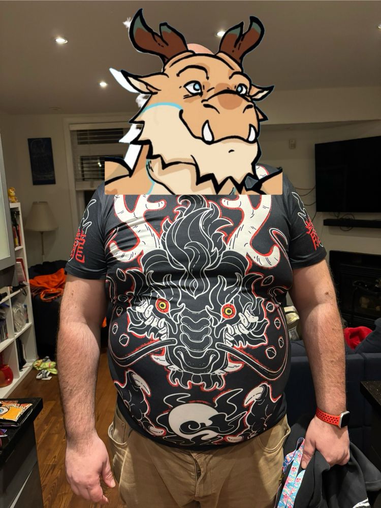 It’s me wearing a snug fitting dragon tshirt. A sticker is over my face 