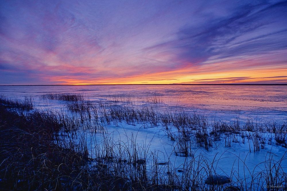 A frozen section of the Last Mountain Lake National Wildlife Area, Saskatchewan, shortly after sunset.