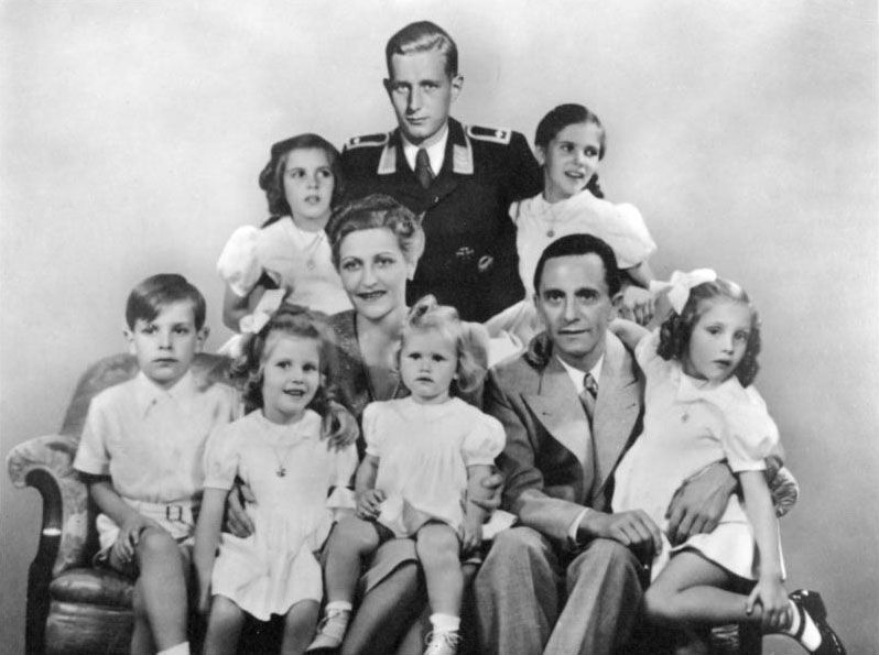 A 1942 Goebbels Family portrait: in the centre are Magda Goebbels and Joseph Goebbels, with their six children Helga, Hildegard, Helmut, Hedwig, Holdine and Heidrun. Behind is Harald Quandt (a son of Magda from a previous marriage, added to the photo in the uniform of a Flight Sergeant of the Air Force.)