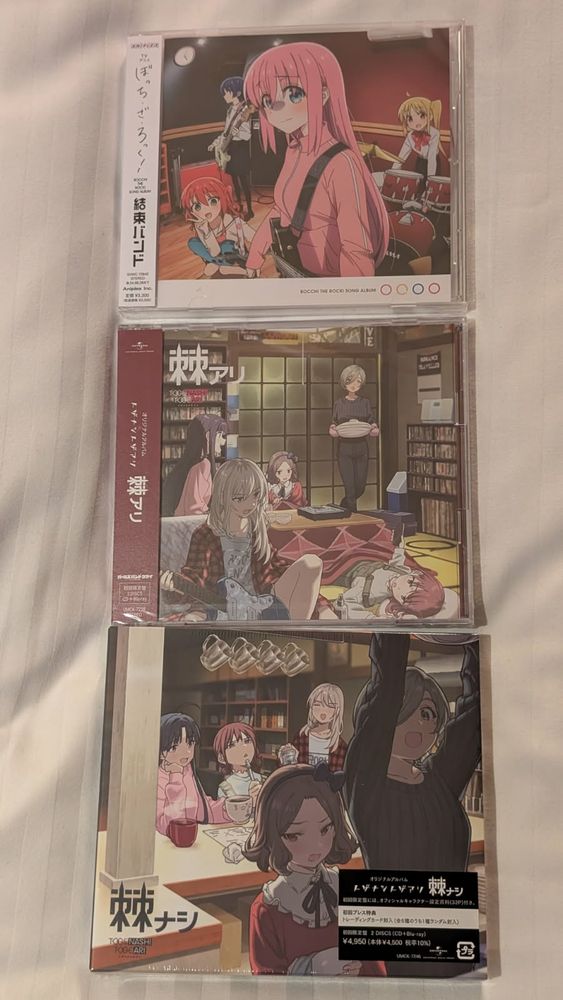 three CDs: the Kessoku Band CD from television anime Bocchi the Rock; and the limited CD/Blu-ray editions of the albums Ari and Nashi, by the band Togenashi Togeari from television anime Girls Band Cry