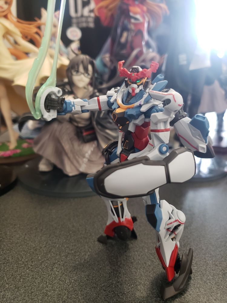 an assembled 1/144 scale model of the titular mecha from the anime series Mobile Suit Gundam GQuuuuuuX
