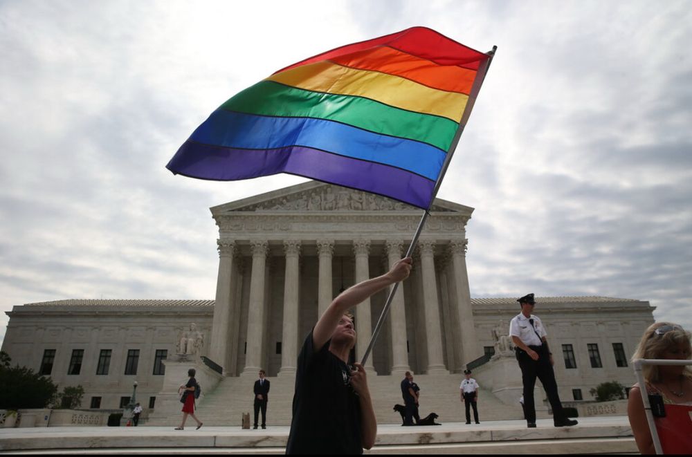 Giant gay flag in front of the Supreme Court