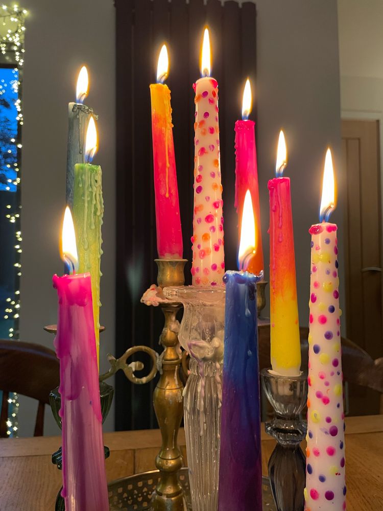 Colourful candles at dusk.