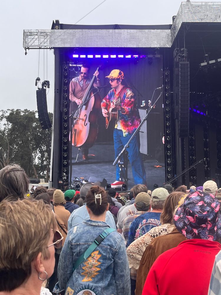 Billy Strings holds his guitar on stage in Golden Gate Park.