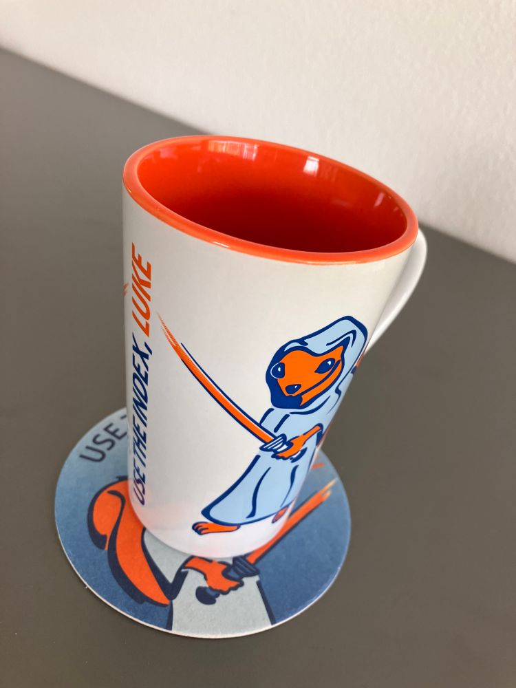 Picture of a coffee mug featuring the "Use The Index, Luke!" mascot.