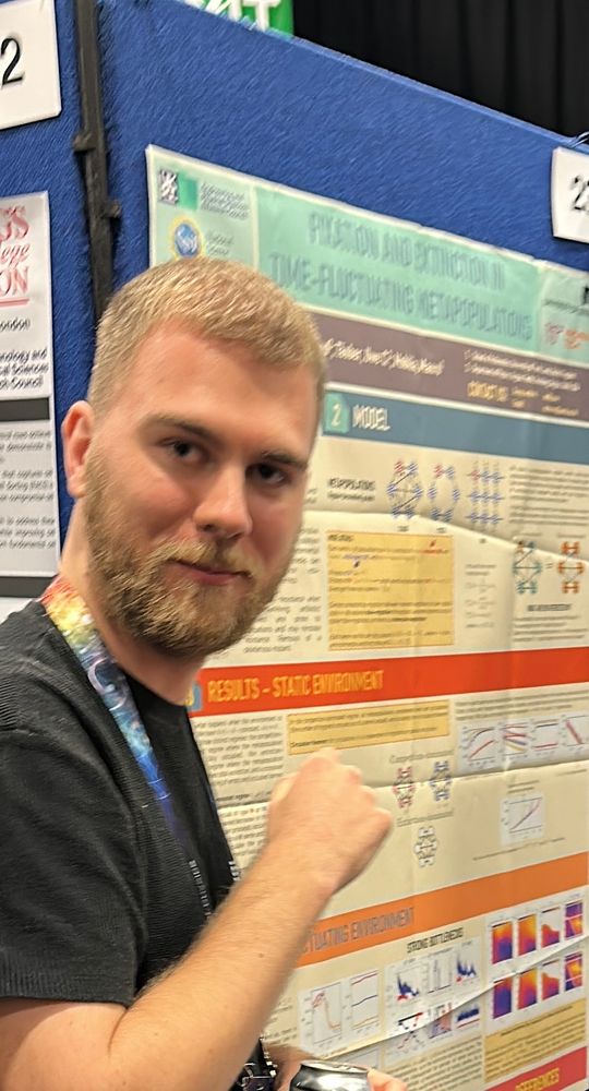 Me, caught slightly off-guard, presenting my poster on "Fixation and extinction in time-fluctuating metapopulations".