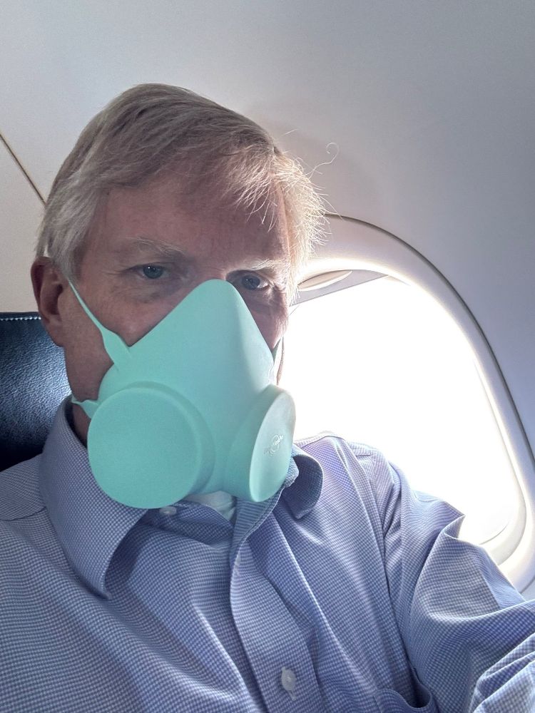 Man wearing the ElastoMaskPro while traveling via airplane.