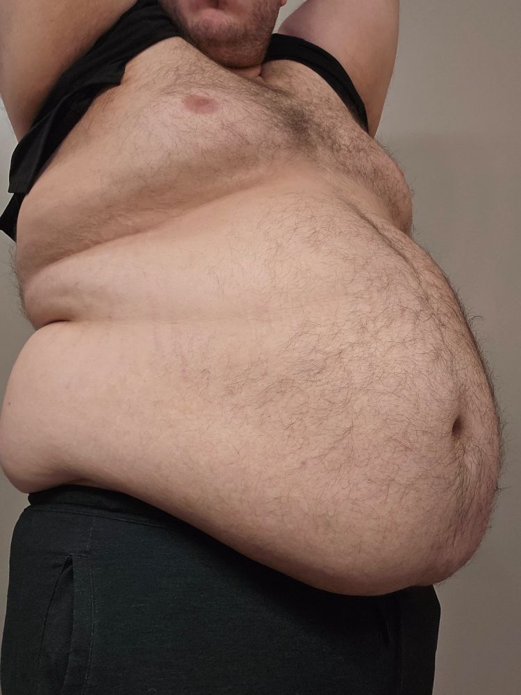 Photo of me with and exposed chest and belly, lifting my arms up