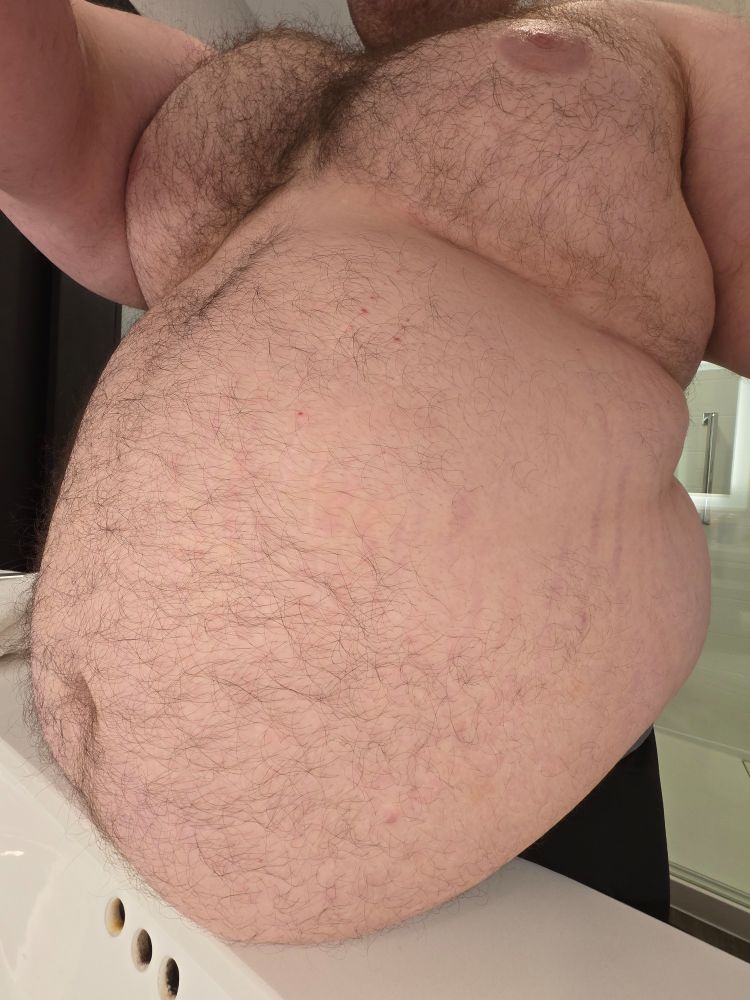 Photo of my belly resting on a counter from the side