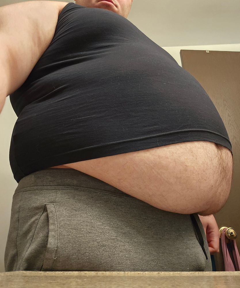 Photo of me in a size large tanktop from the side