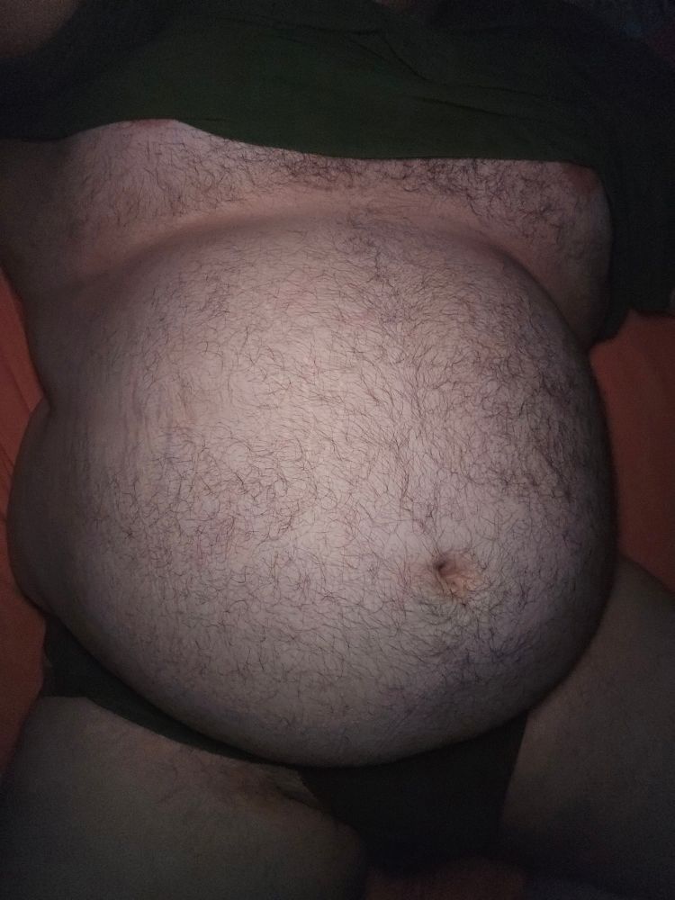 Photo of my belly while I lay in bed