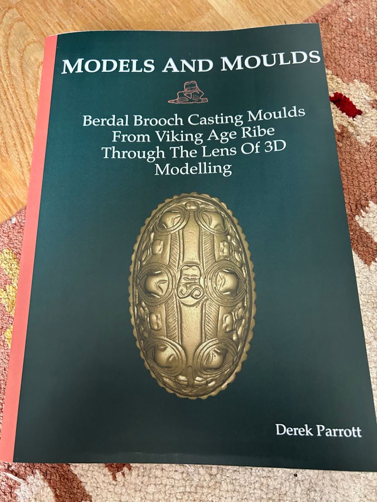 Photo of a PhD dissertation entitled “Models and Moulds: Berdal brooch moulds from Viking Age Ribe through the lens of 3D modelling”