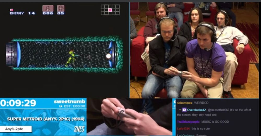 Two people playing one video game by each holding half the controller