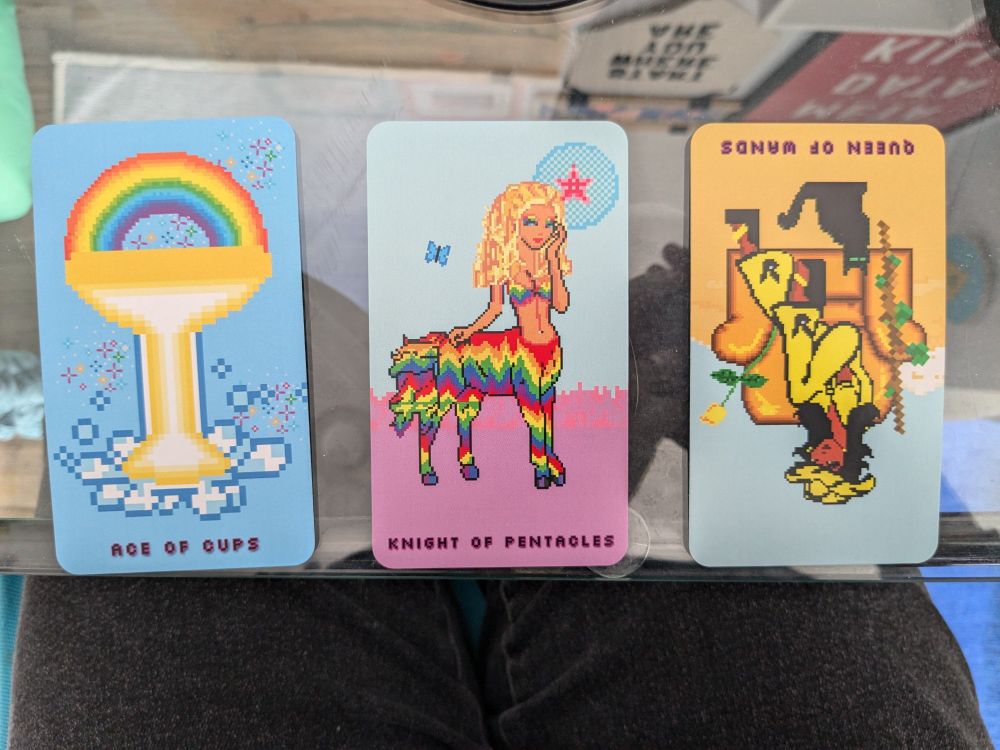 Three card spread: ace of cups, knight of pentacles, reversed queen of wands 