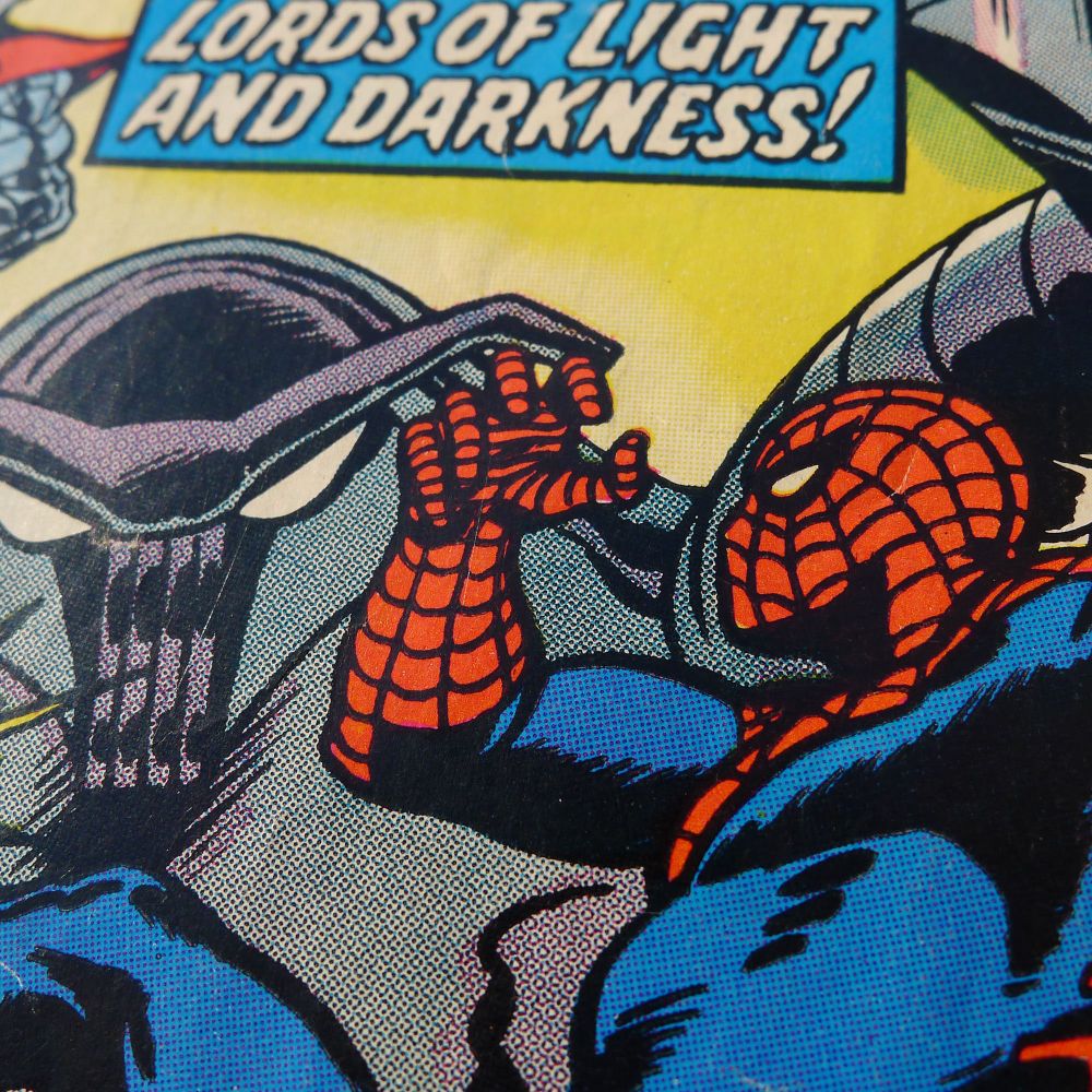 Spider-Man swinging towards a weird crablike robot with the text "Lords of Light and Darkness!" in a blue caption box above them.