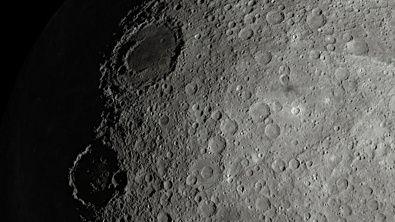 Above left Mare Kyiv, a flat area with a crater ring inside, below of it crater Mendeleev.