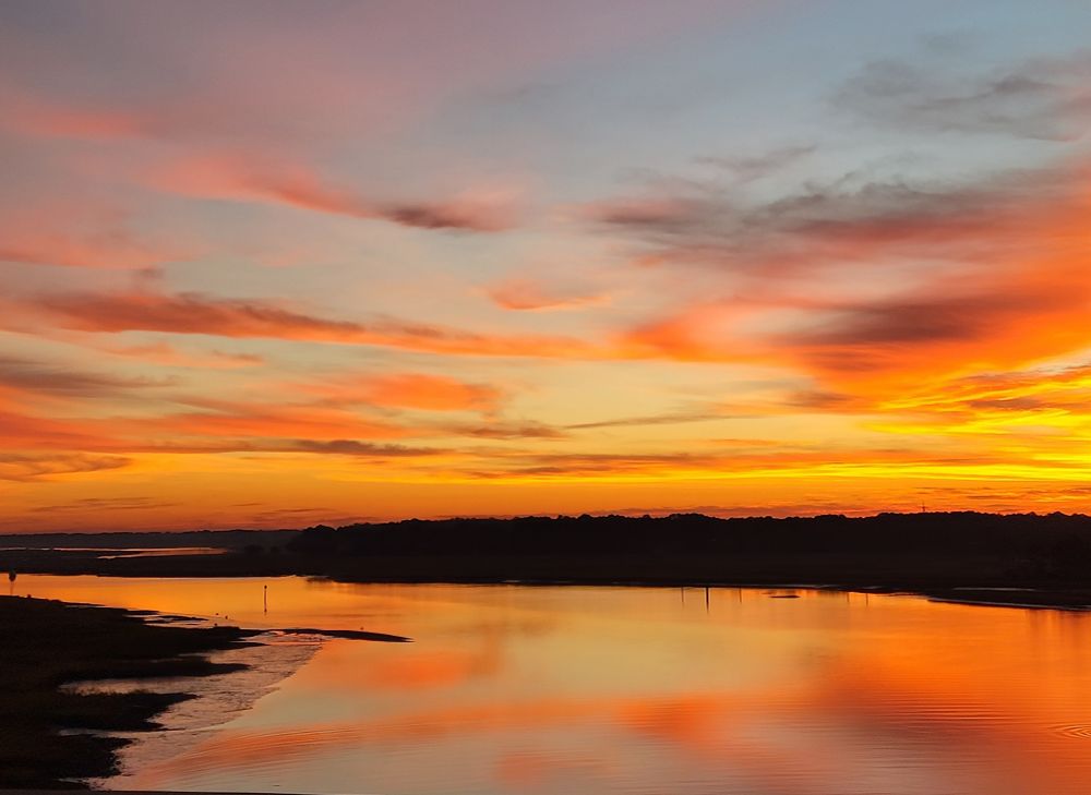 The sky in orange and blue, reflecting off the inlet waters near Hilton Head Island in South Carolina.