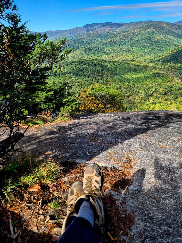 Top of the Rock. Looking Glass Mountain. Resting weary feet while staring at bright green rolling hills.