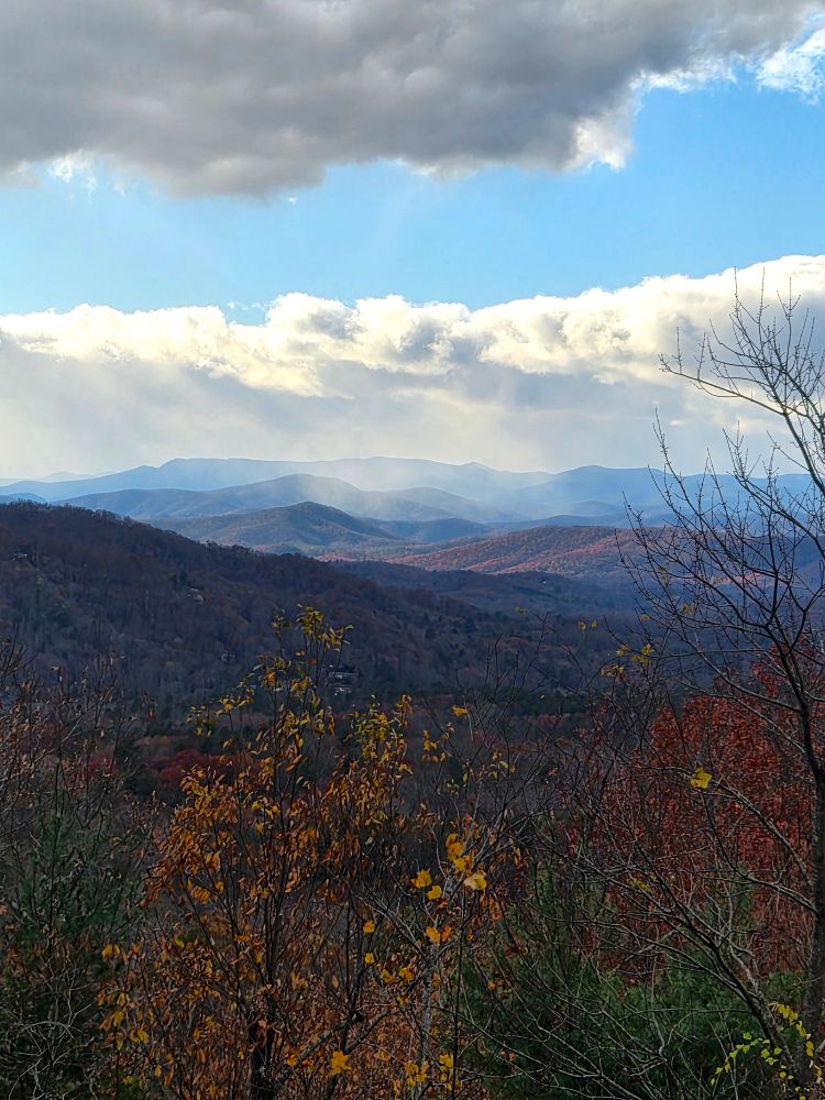 Taken last Monday. A brief mountain snow shower. Fall foilage still shining brightly.